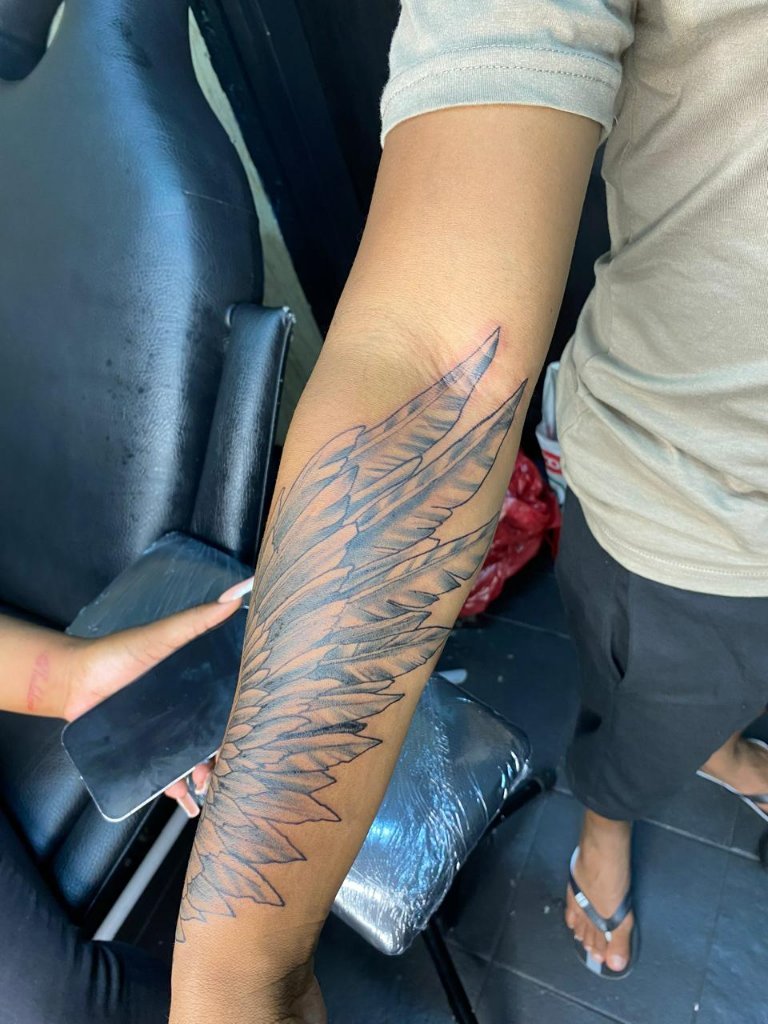 Angel Wing Arm Tattoo